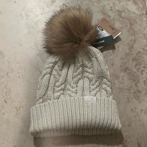 The North Face - cream knit beanie with faux fur puff